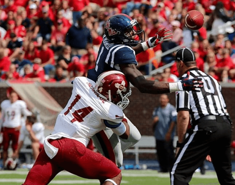 Roedion Henrique, #14 making a tackle on a Ole Miss Wide Receiver